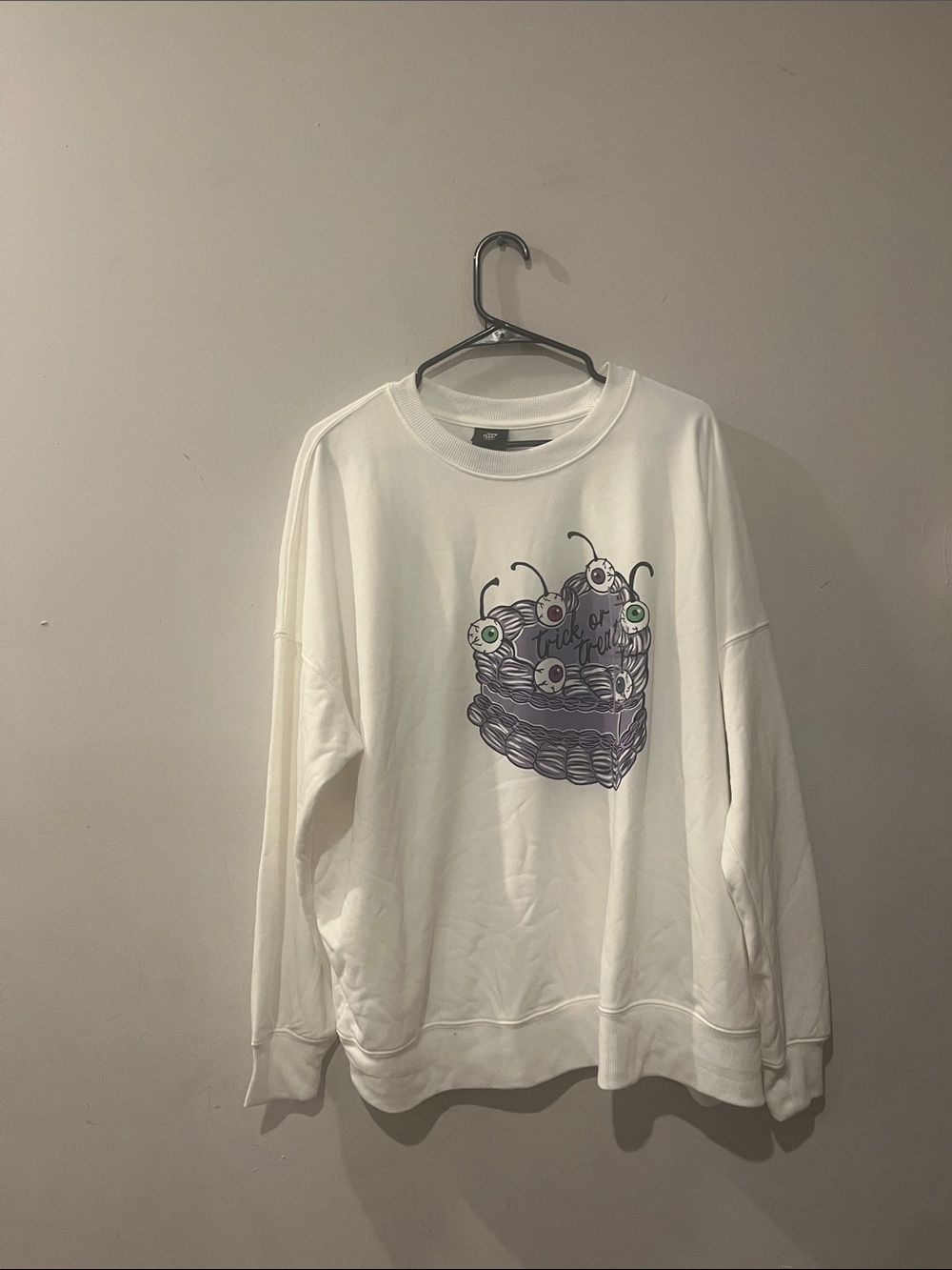 White Men’s Graphic Sweatshirt with Purple Cake Design